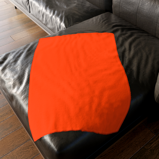 A custom Lily Munster gothic blanket draped over a velvet sofa, showcasing unique pop art decor for a spooky home. For sale in The Fright Factory, New Orleans.