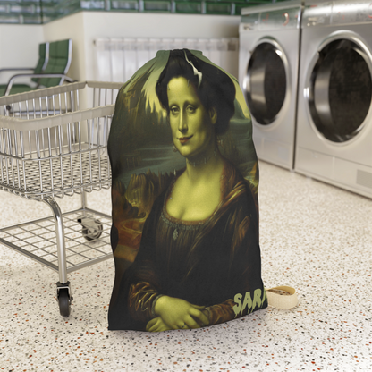 Fine art horror parody: Mona Lisa as the Bride of Frankenstein on a large drawstring laundry bag with custom name personalization. From The Fright Factory NOLA.