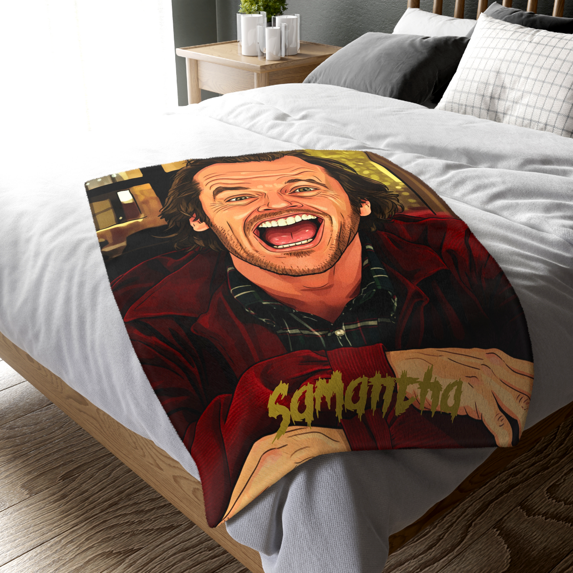Full view of The Shining Jack Torrance bed throw laid flat, showing the large-scale custom artwork of Jack Torrance centered on the blanket. Designed and sold only in The Fright Factory New Orleans.