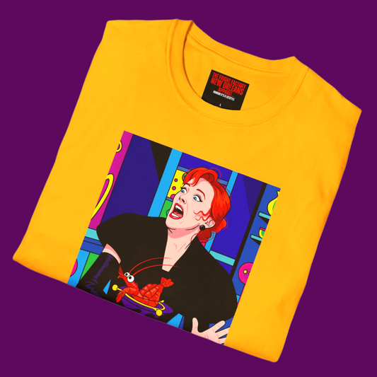 Close-up of the high-quality pop art print of Delia Deetz, showing the sharp lines and vivid ink colors on the black cotton fabric of the T-shirt.
