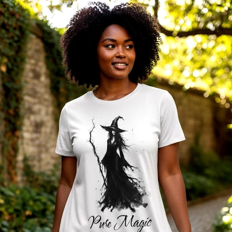 Model wearing the Pure Magic witch graphic nightshirt styled as a gothic aesthetic black t-shirt dress featuring a black watercolor witch illustration and elegant script font. Designed in The Fright Factory New Orleans witch gift shop.