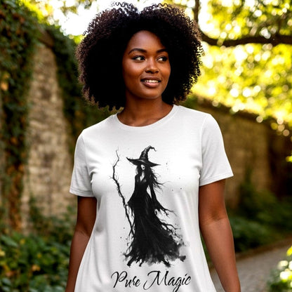 Model wearing the Pure Magic witch graphic nightshirt styled as a gothic aesthetic black t-shirt dress featuring a black watercolor witch illustration and elegant script font. Designed in The Fright Factory New Orleans witch gift shop.