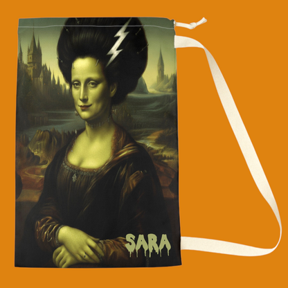Personalized laundry bag featuring a Bride of Frankenstein Mona Lisa art mashup with the name 'SARA' in a dripping horror font by Fright Factory NOLA.