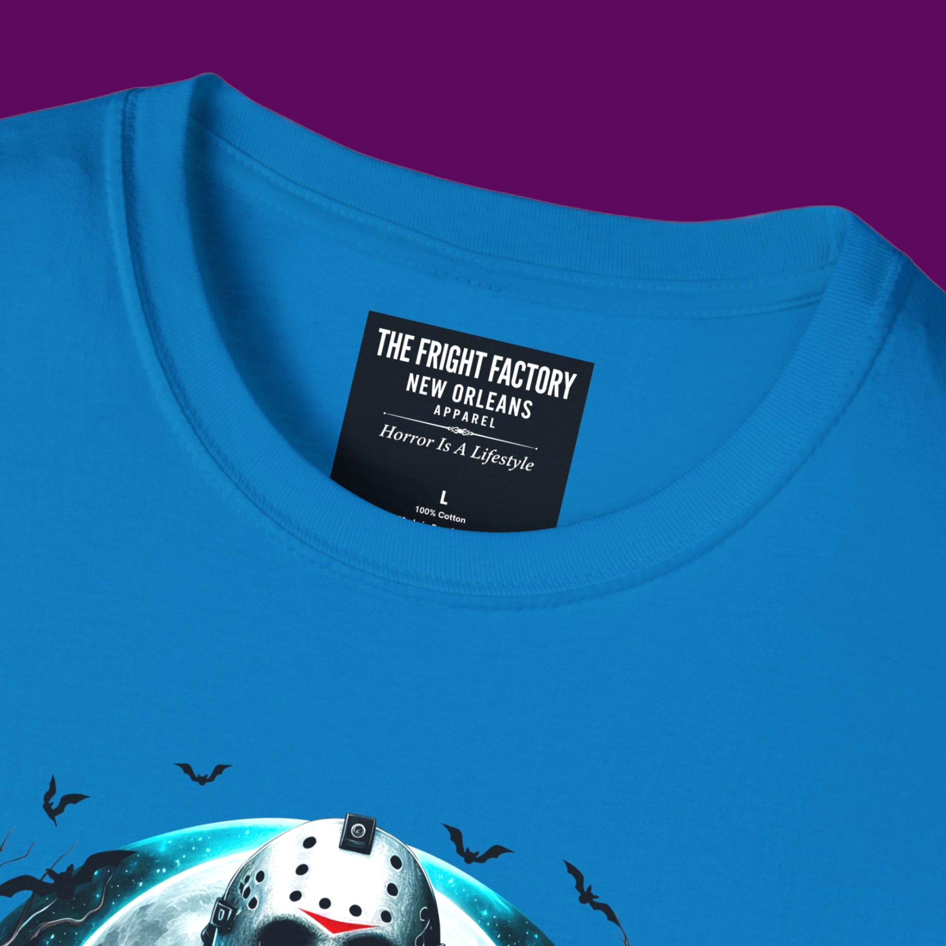 Close up of my label of Jason Voorhees hockey mask graphic t-shirt in a bold pop art style, printed on a 100% cotton unisex tee by The Fright Factory New Orleans.
