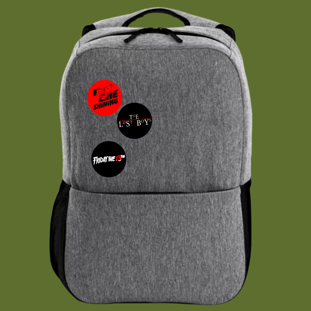 Evil Dead 1.5 inch handmade pinback button featured on a backpack and hand-pressed at The Fright Factory NOLA.