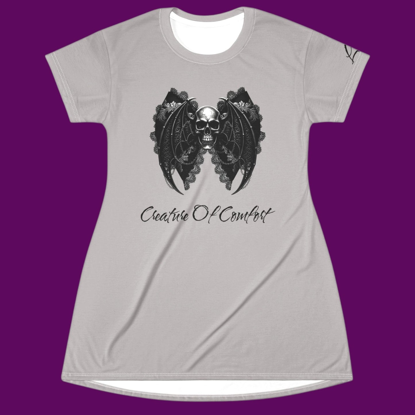 Custom Creature of Comfort graphic nightshirt styled as a gothic skull dress with a white contrast neck, featuring a bat-wing lace skull illustration for The Fright Factory, New Orleans.