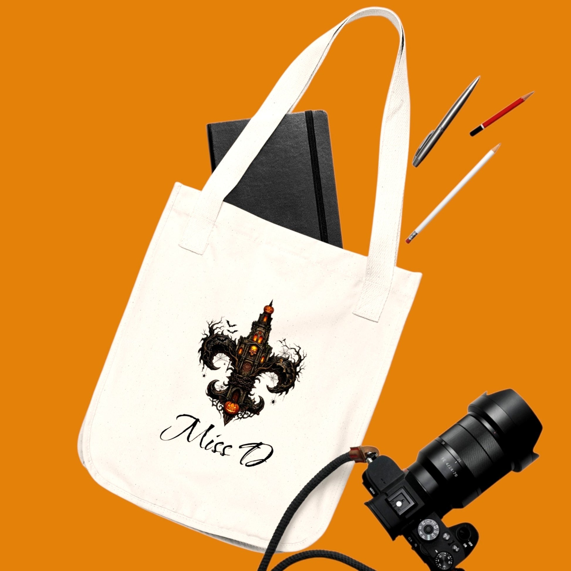 Carry your magic in style. Our personalized Gothic Fleur-de-Lis Tote features durable organic cotton & personalized text. From The Fright Factory, NOLA Halloween gift shop!