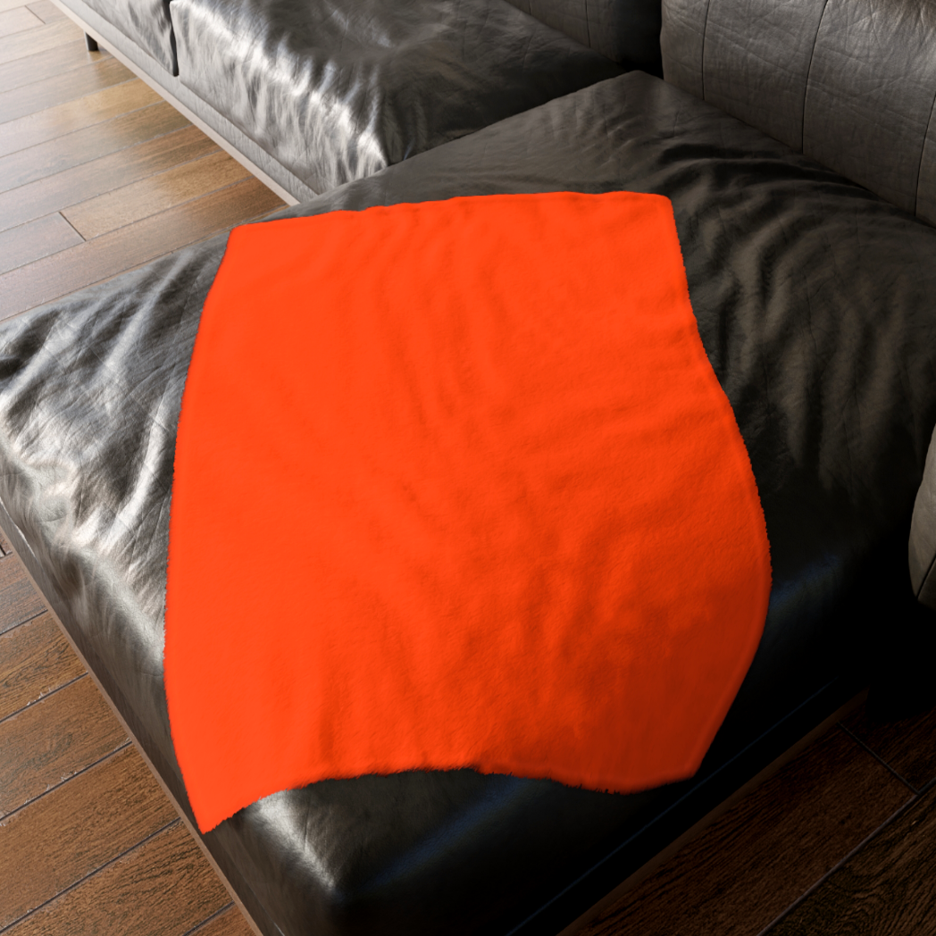 A custom Lily Munster gothic blanket draped over a velvet sofa, showcasing unique pop art decor for a spooky home. For sale in The Fright Factory, New Orleans.