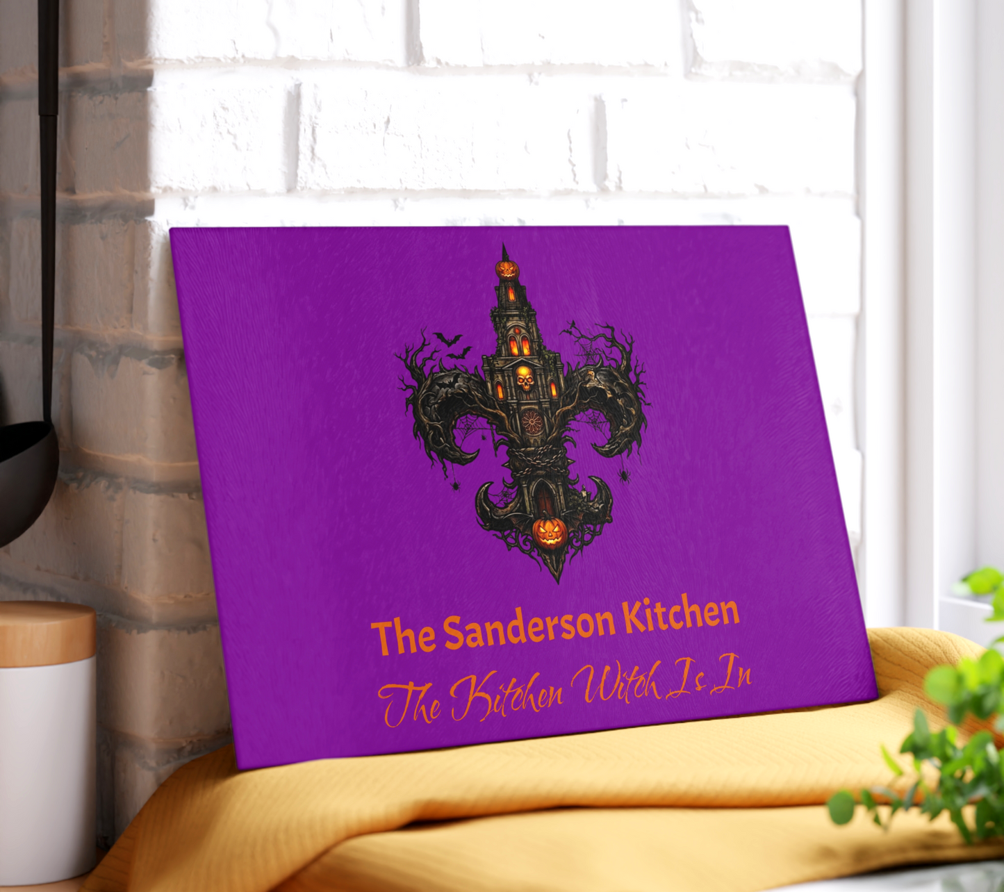 Personalized tempered glass cutting board with a vibrant purple background featuring an intricate gothic fleur-de-lis shaped like a haunted st louis cathedral tower with glowing jack-o'-lanterns, skulls, and bats. Custom kitchen witch decor by The Fright Factory, New Orleans gift shop.