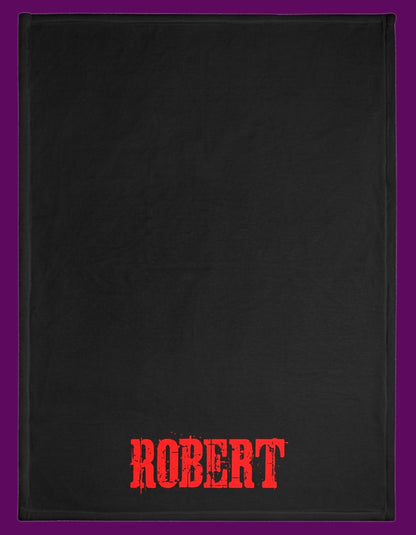 Back side of a multi-color personalized Cujo poster horror-themed blanket. For sale in in The Frght Factory, New Orleans.